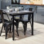 white-ceramic-mug-on-black-dining-table-with-four-chair-set-932095