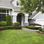 Newly painted and stained exterior of modern home during summert