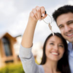 Couple holding house keys